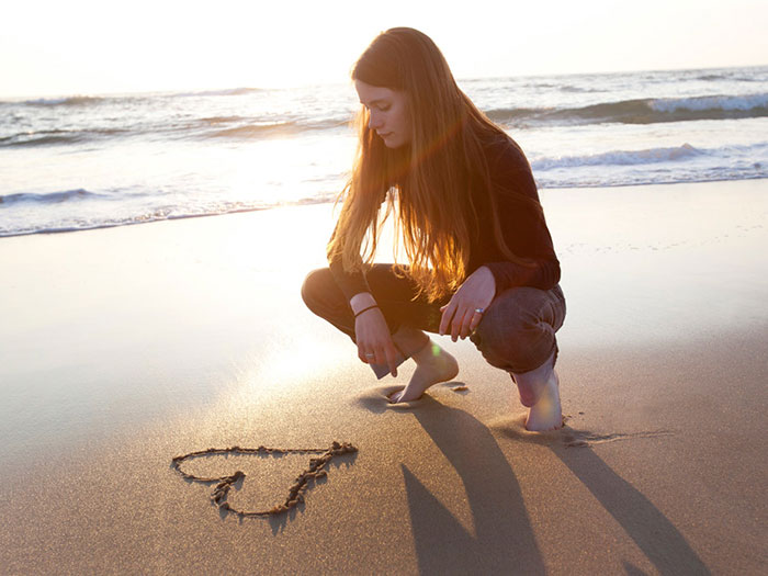 Foot Health for everyone, girl on beach, heart in sand