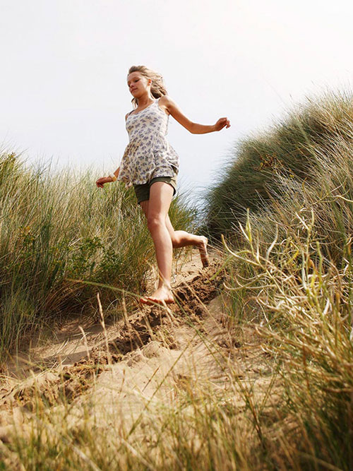 Girl running barefoot 